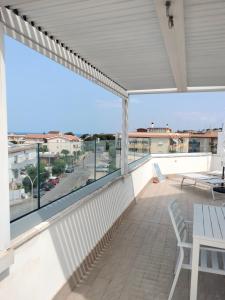 a balcony with a view of a parking lot at Attichetto monolocale vista mare terrazzatissimo Asterspace in Anzio