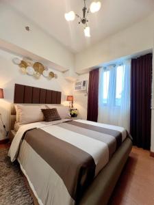 Postel nebo postele na pokoji v ubytování Cebu Sweet Staycation 1 bedroom condo