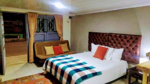 a bedroom with a bed and a chair at mini loft apart studio Salento in Salento