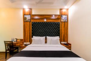 Postel nebo postele na pokoji v ubytování FabHotel Hill Fort