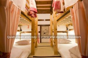 Postel nebo postele na pokoji v ubytování Guest House Pongyi