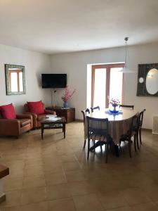a living room with a table and a couch at Casa vacanze Maria in Agropoli