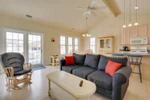 a living room with a couch and a table at Ocean City Family Getaway about Qtr-Mi to Beach! in Ocean City