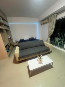 a bedroom with a bed and a coffee table at Studio in Haven in Bangkok +64 photos