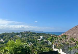 a view of the ocean from a house at Villa JuPITER, Boracay, ocean view holiday home in Boracay +31 photos