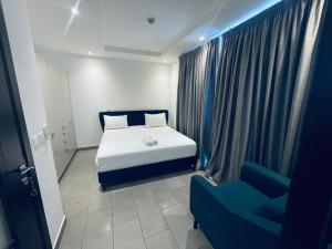Ένα ή περισσότερα κρεβάτια σε δωμάτιο στο The Edge Apartments