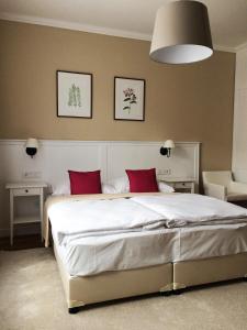Postel nebo postele na pokoji v ubytování Erhardt Superior Rooms