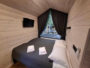 Ένα ή περισσότερα κρεβάτια σε δωμάτιο στο SmartVille Kyiv