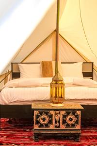 a bedroom with a bed in a tent at Authentic Private Tent in Bidiyah +27 photos