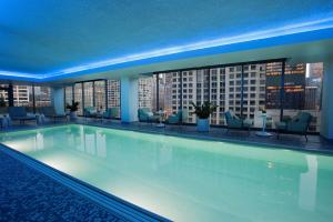 a swimming pool with a view of a building at The Royal Sonesta Chicago River North in Chicago