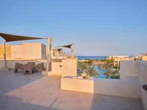 a balcony of a resort with a view of the ocean at Boutique Residence Mangroovy-Lemon Spaces Gouna in Hurghada