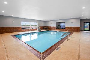 a large swimming pool in a large room at Spark by Hilton Fort Stockton in Fort Stockton