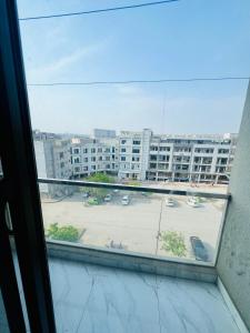 a view of a parking lot from a window at 1 one bed flat furnished Bahria Town Rawalpindi Islamabad in Rawalpindi +12 photos