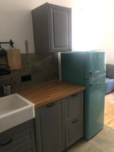 Η κουζίνα ή μικρή κουζίνα στο Cosy Sacz +1 φωτογραφίες