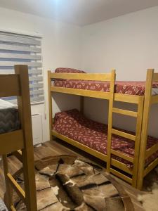 two bunk beds in a room with a window at Hadziluk vila in Sarajevo +7 photos