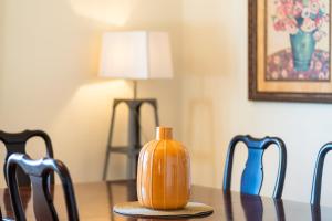 a pumpkin sitting on top of a table with chairs at GuestReady - Sea-View Retreat in Madeira in Santo António
