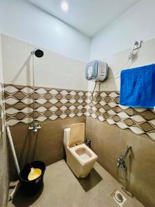 a bathroom with a toilet and a shower at 1 bed furnished apartment flat Bahria town Rwp isb in Rawalpindi