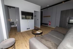 a living room with a couch and a table at LL Properties - TB24 The Boutique Flat in Akureyri