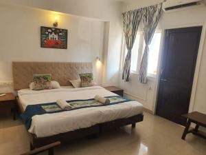 Postel nebo postele na pokoji v ubytování Mayfair Hotel + 7 fotografií