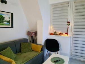 a living room with a couch and a table at Zmaj 16 in Divčibare