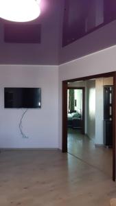 an empty room with a white wall and a ceiling at Apart in Ivano-Frankivsʼk +2 photos