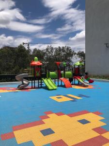 a playground with colorful equipment on a carpet at Reily Luxury Homes - Studio Apartment, Syokimau near JKIA & SGR, PARK VIEW in Nairobi
