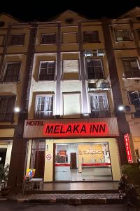 a hotel melaka inn is lit up at night at Hotel Melaka INN in Melaka