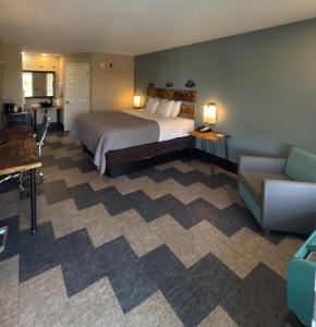 a hotel room with a bed and a couch at Southern Soho Boutique Hotel in Oxford