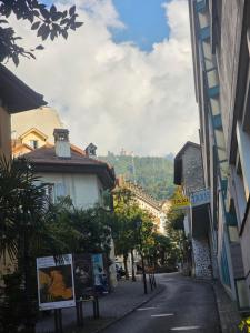 an empty street in a town with buildings at Petit studio centre ville in Montreux +2 photos