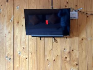 a tv sitting on top of a wooden floor at The Natures Nuwaraeliya in Nuwara Eliya