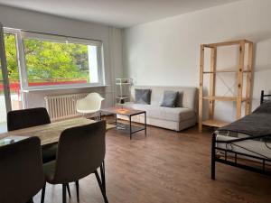 a living room with a couch and a table at LuxusCityApartment in Berlin