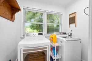 a kitchen with a white stove and a sink at 1910 Asheville Gem in Fairview +43 photos