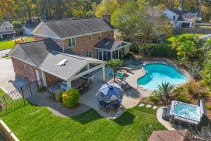 an aerial view of a house with a swimming pool at The Raleigh Resort House in Millbrook