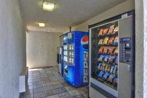 a vending machine in a store with drinks in it at Motel 6-West Sacramento, CA in West Sacramento