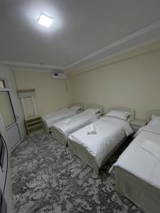 Ένα ή περισσότερα κρεβάτια σε δωμάτιο στο Shinam Hostel