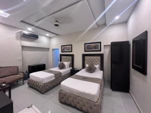 Ένα ή περισσότερα κρεβάτια σε δωμάτιο στο Park View Hotel Gulberg +81 φωτογραφίες