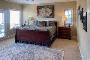 a bedroom with a bed and two windows at Central Terrace Retreat in Hot Springs