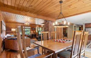a dining room with a table and a chessboard at 4BR Mountain retreat with Ski Base Bikes & Yard in Bartlett