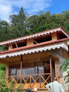 two men standing in front of a house at Walk in Himalayas in Pelling