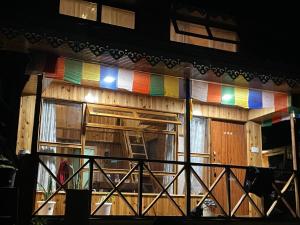 a building with a window with rainbow colored glass at Walk in Himalayas in Pelling