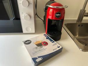 a box sitting on a counter next to a coffee maker at Bilocale economico, in pieno centro a Lucca in Lucca