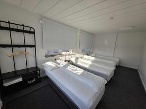 a room with two large beds in it at Office Motel in Gothenburg