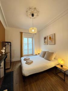 Postel nebo postele na pokoji v ubytování Bienvenu en Anjou