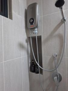 a shower in a bathroom with a shower head at MKH 2 New Era 1 Bed Room Up to 4 PAX in Kajang