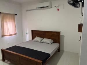 Ένα ή περισσότερα κρεβάτια σε δωμάτιο στο Mapa Group Rest House