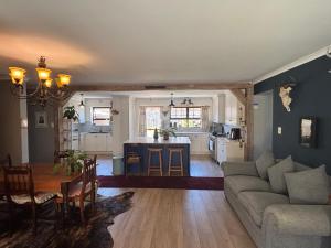 a living room with a couch and a table at Vintage Tide in Cape Town