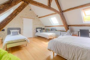 Postel nebo postele na pokoji v ubytování La gourmandière aux bruyères + 24 fotografií