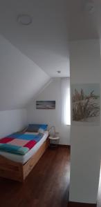 a bedroom with a bed in a room at Bilstein RE04 in Sögel +10 photos