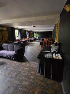 a living room with a couch and a table at "Zacisze" in Zgierz