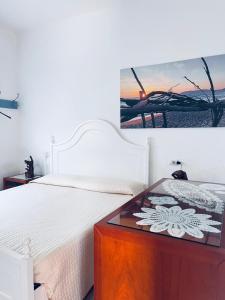 Postel nebo postele na pokoji v ubytování Casa vacanza I Limoni